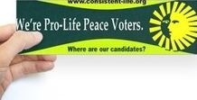 Voter holding Where Are Our Candidates sticker