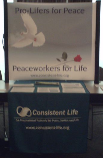 Consistent Life display table at Peace and Justice Studies Association Conference